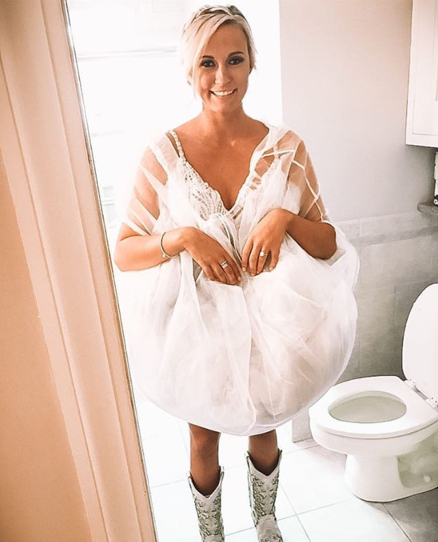The Bridal Buddy allows brides to use the toilet without